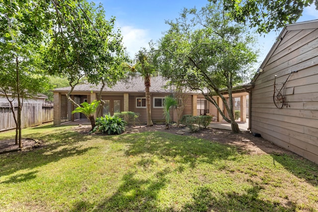 1406 Diana Ct, Houston, TX 77062 - view of yard featuring french doors and a patio