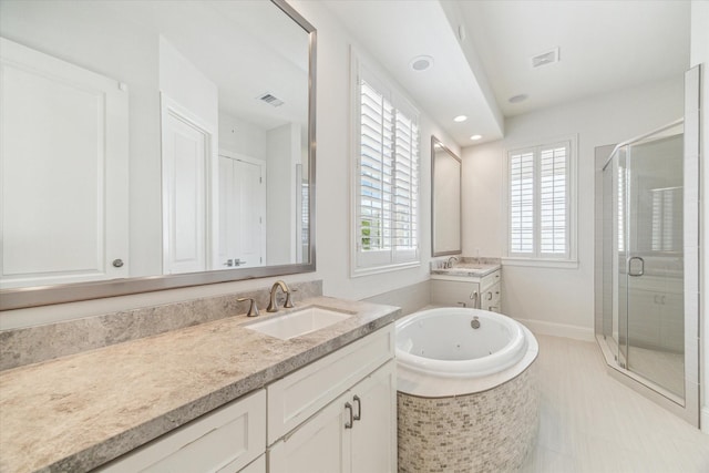 1206 Lake Pointe Pkwy, Sugar Land, TX 77478 - bathroom featuring a stall shower, two vanities, a whirlpool tub, recessed lighting, and tile patterned floors