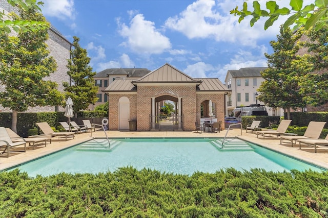 1206 Lake Pointe Pkwy, Sugar Land, TX 77478 - community pool with a patio