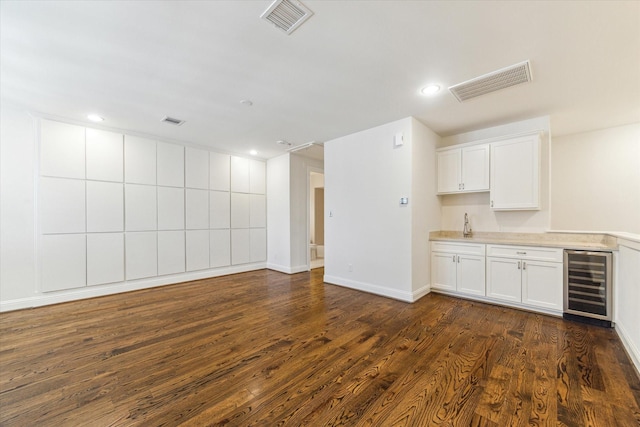 1206 Lake Pointe Pkwy, Sugar Land, TX 77478 - bar with wine cooler, dark wood-style floors, and recessed lighting