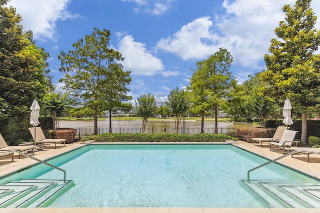 1206 Lake Pointe Pkwy, Sugar Land, TX 77478 - community pool with a patio area and a water view