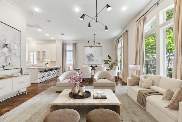 1206 Lake Pointe Pkwy, Sugar Land, TX 77478 - living room featuring ornamental molding, wood finished floors, and recessed lighting