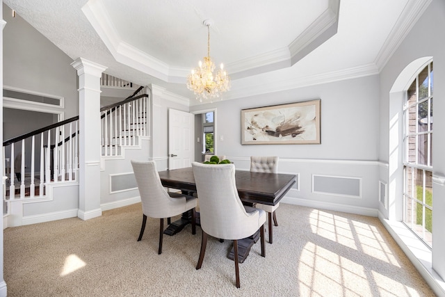 427 Crestwater Trl, Houston, TX 77082 - dining room with plenty of natural light, a chandelier, stairs, ornamental molding, and carpet