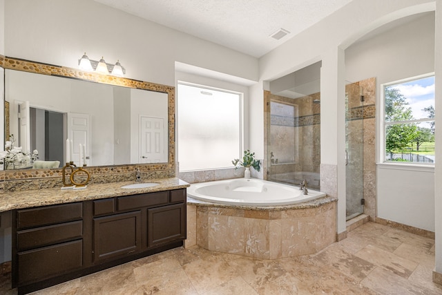 427 Crestwater Trl, Houston, TX 77082 - full bathroom featuring a bath, a shower stall, and vanity