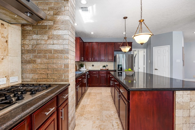 427 Crestwater Trl, Houston, TX 77082 - kitchen featuring reddish brown cabinets, stainless steel appliances, ventilation hood, tasteful backsplash, and a center island