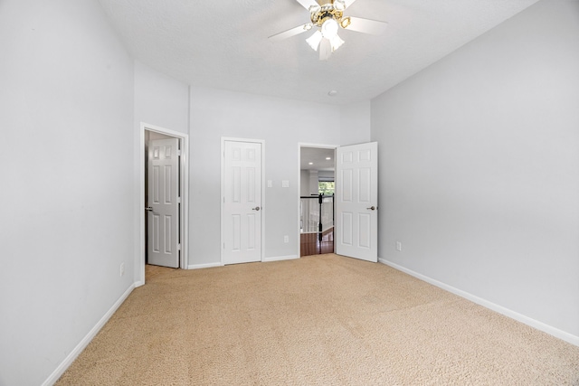 427 Crestwater Trl, Houston, TX 77082 - unfurnished bedroom with carpet floors, ceiling fan, and a towering ceiling