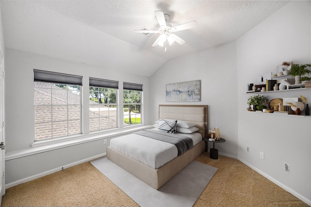 427 Crestwater Trl, Houston, TX 77082 - carpeted bedroom featuring vaulted ceiling, ceiling fan, and a textured ceiling