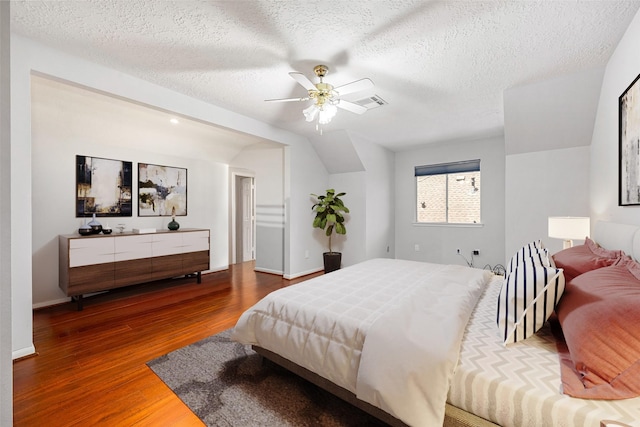 427 Crestwater Trl, Houston, TX 77082 - bedroom with wood finished floors, a textured ceiling, and a ceiling fan