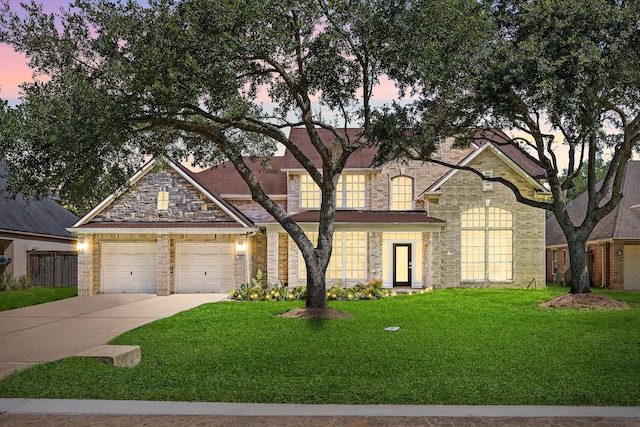 427 Crestwater Trl, Houston, TX 77082 - view of front of home with a lawn, driveway, and brick siding