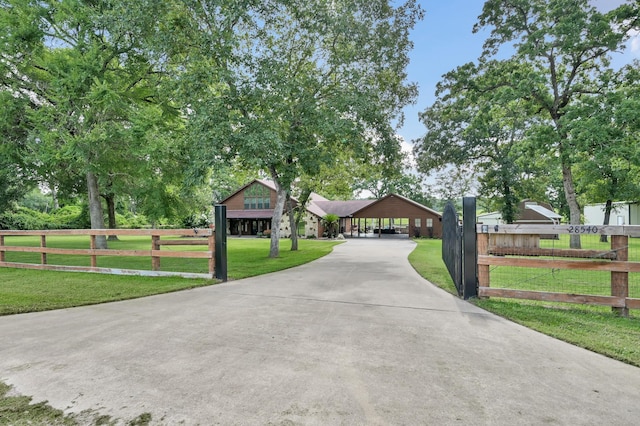 28540 Lynnwood Ln, Hempstead, TX 77445 - view of front of house featuring driveway and a carport