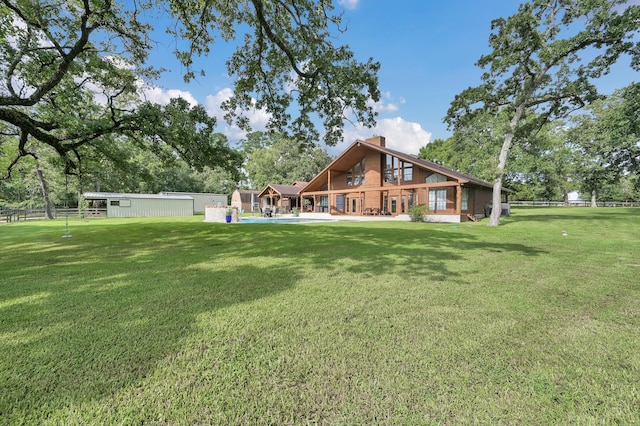 28540 Lynnwood Ln, Hempstead, TX 77445 - back of house featuring a chimney and a swimming pool