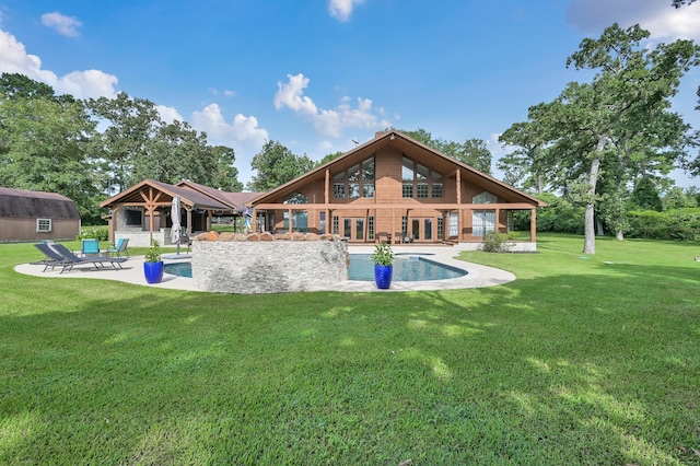 28540 Lynnwood Ln, Hempstead, TX 77445 - back of house featuring french doors, an outdoor pool, a yard, and a patio area