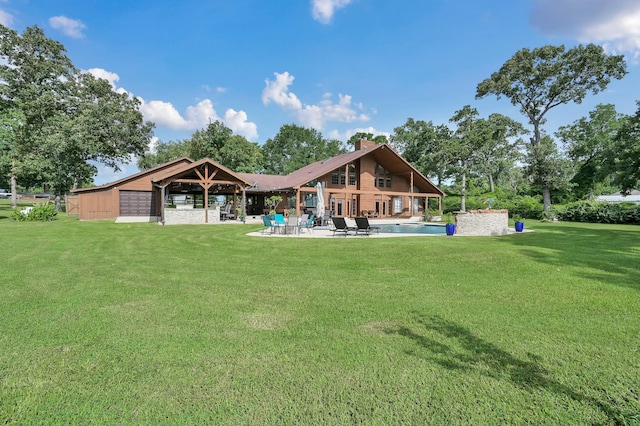 28540 Lynnwood Ln, Hempstead, TX 77445 - back of house with a patio area, a yard, and an outdoor pool