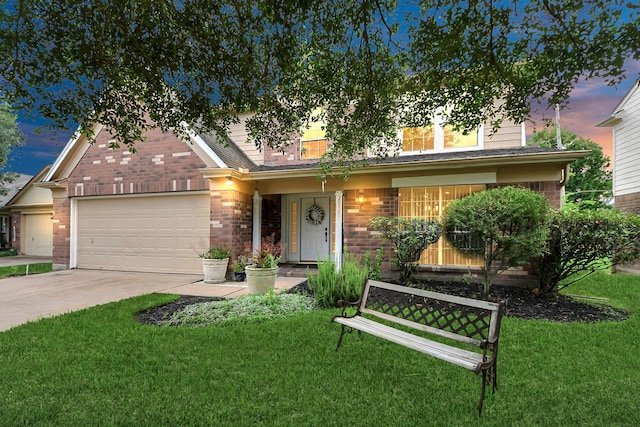 20527 Apache Lake Dr, Katy, TX 77449 - view of front of house featuring concrete driveway, an attached garage, brick siding, and a front lawn