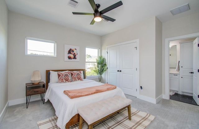 4612 Oats St, Houston, TX 77020 - bedroom with light carpet, a closet, connected bathroom, and a ceiling fan