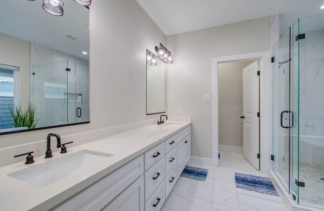 4612 Oats St, Houston, TX 77020 - bathroom featuring marble look tile flooring, double vanity, and a shower stall