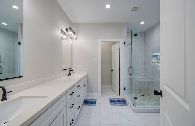 4612 Oats St, Houston, TX 77020 - bathroom with marble look tiles, double vanity, recessed lighting, and a shower stall