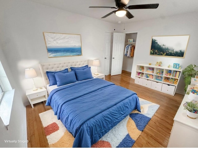 11026 Catamore St, Houston, TX 77076 - bedroom featuring wood finished floors, a ceiling fan, a closet, and a spacious closet