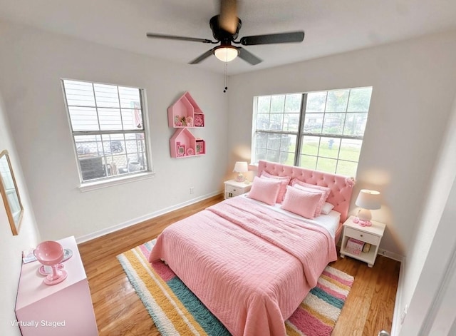 11026 Catamore St, Houston, TX 77076 - bedroom featuring wood finished floors and a ceiling fan