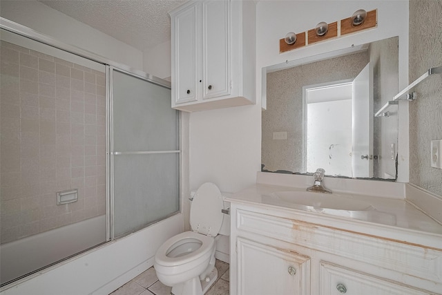 11280 Braes Forest Dr Unit 105, Houston, TX 77071 - full bathroom with vanity, enclosed tub / shower combo, a textured ceiling, and tile patterned floors