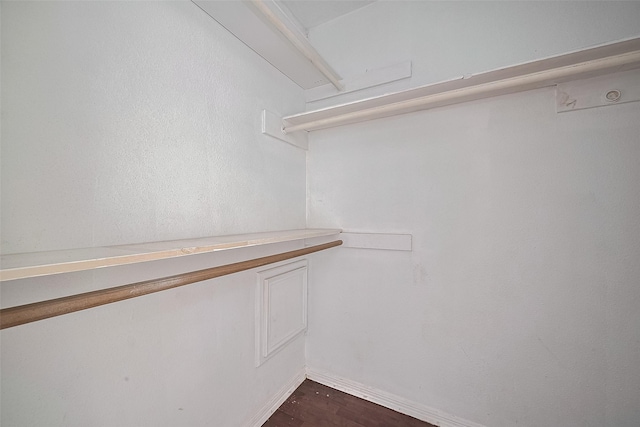 11280 Braes Forest Dr Unit 105, Houston, TX 77071 - walk in closet featuring dark wood finished floors