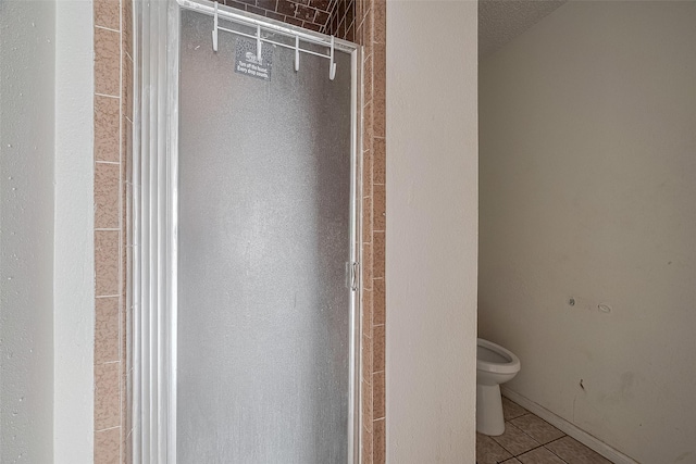 11280 Braes Forest Dr Unit 105, Houston, TX 77071 - bathroom with toilet and tile patterned floors