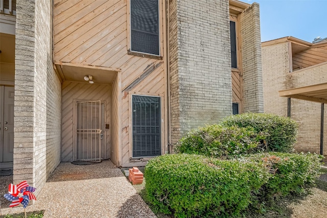 11280 Braes Forest Dr Unit 105, Houston, TX 77071 - doorway to property featuring brick siding