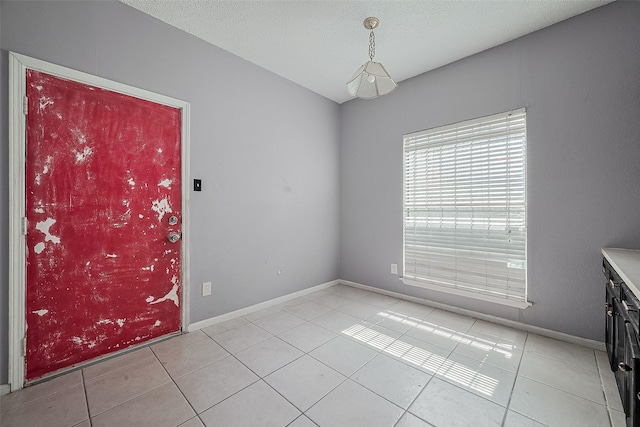 11280 Braes Forest Dr Unit 105, Houston, TX 77071 - empty room featuring light tile patterned floors and baseboards