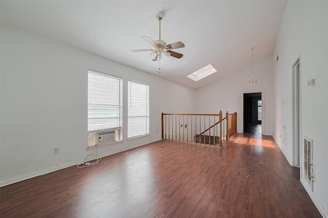 11280 Braes Forest Dr Unit 105, Houston, TX 77071 - empty room featuring ceiling fan, wood finished floors, a skylight, a textured ceiling, and lofted ceiling