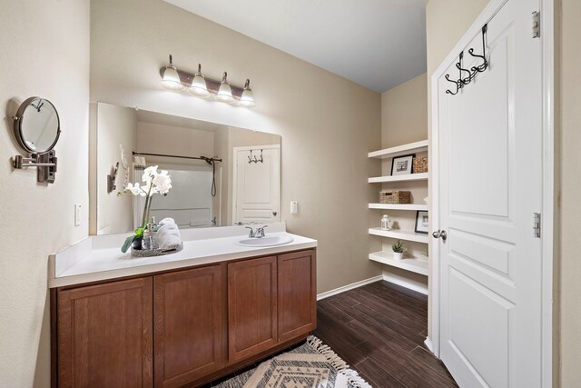 6707 Enchanted Crest Dr, Katy, TX 77449 - full bathroom with wood finished floors and vanity