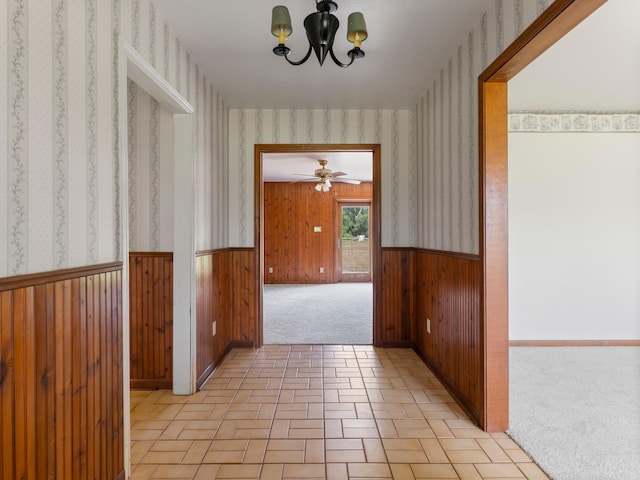 4432 County Road 886, Brazoria, TX 77422 - corridor with wallpapered walls, wainscoting, a chandelier, and wood walls