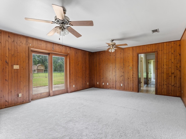 4432 County Road 886, Brazoria, TX 77422 - carpeted spare room with a ceiling fan and wood walls