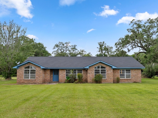 4432 County Road 886, Brazoria, TX 77422 - single story home featuring a front yard, brick siding, and a shingled roof