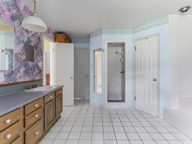 4432 County Road 886, Brazoria, TX 77422 - bathroom featuring vanity, tile patterned floors, tiled shower, wallpapered walls, and a bathtub