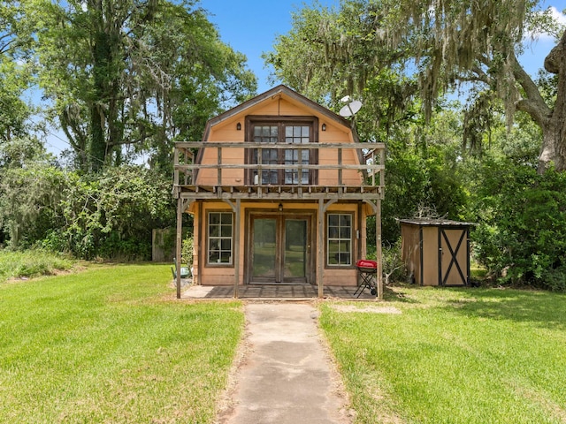 4432 County Road 886, Brazoria, TX 77422 - rear view of house with a shed, french doors, a yard, and a deck