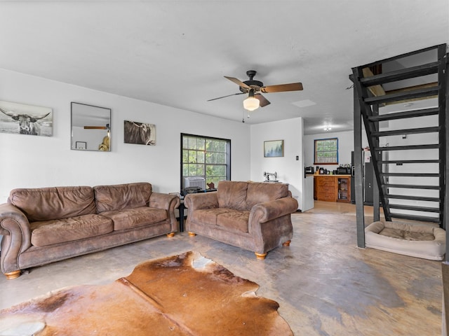 4432 County Road 886, Brazoria, TX 77422 - living area with finished concrete floors and ceiling fan
