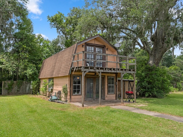 4432 County Road 886, Brazoria, TX 77422 - back of house with a deck, a shingled roof, and a gambrel roof