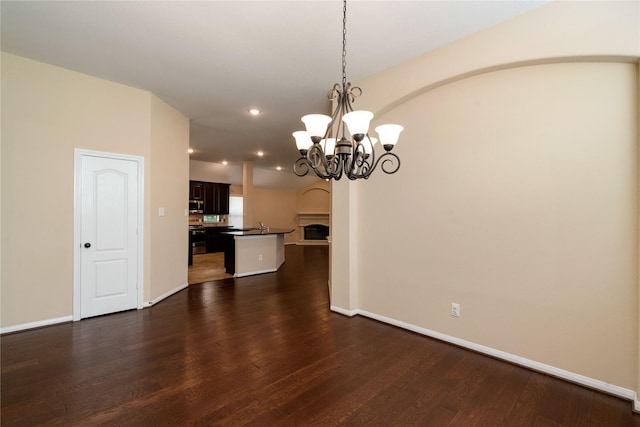 38 Tallgrass Way, Spring, TX 77389 - unfurnished dining area featuring a chandelier, dark wood-style floors, and recessed lighting