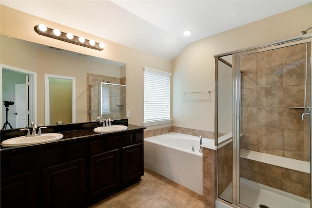 38 Tallgrass Way, Spring, TX 77389 - bathroom featuring a stall shower, a garden tub, double vanity, vaulted ceiling, and tile patterned floors