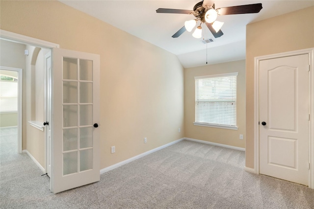 38 Tallgrass Way, Spring, TX 77389 - unfurnished bedroom with carpet, vaulted ceiling, multiple windows, and ceiling fan