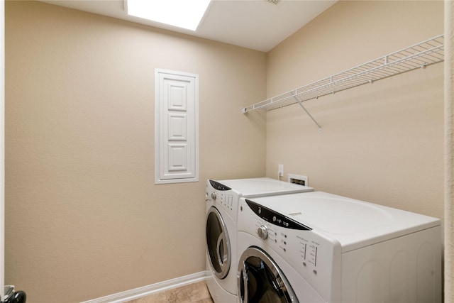 38 Tallgrass Way, Spring, TX 77389 - washroom featuring separate washer and dryer and baseboards