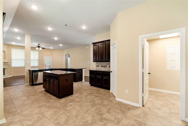 38 Tallgrass Way, Spring, TX 77389 - kitchen featuring ceiling fan, an island with sink, dishwasher, recessed lighting, and decorative backsplash
