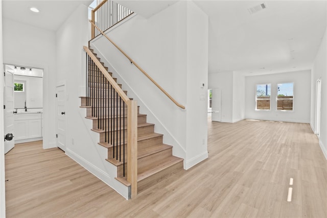 4102 Kewanee St, Houston, TX 77051 - stairs featuring healthy amount of natural light, wood finished floors, and recessed lighting