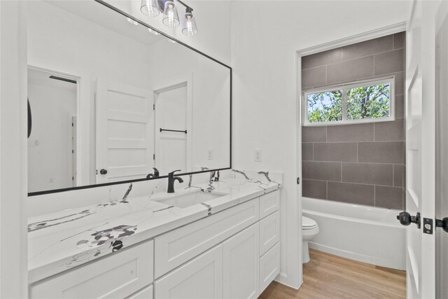 4102 Kewanee St, Houston, TX 77051 - bathroom with vanity, wood finished floors, and tub / shower combination
