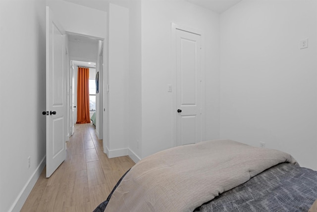 825 Rd 5501, Cleveland, TX 77327 - bedroom with baseboards and light wood-type flooring