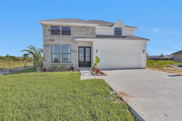 825 Rd 5501, Cleveland, TX 77327 - view of front of property with french doors, a shingled roof, an attached garage, driveway, and stone siding