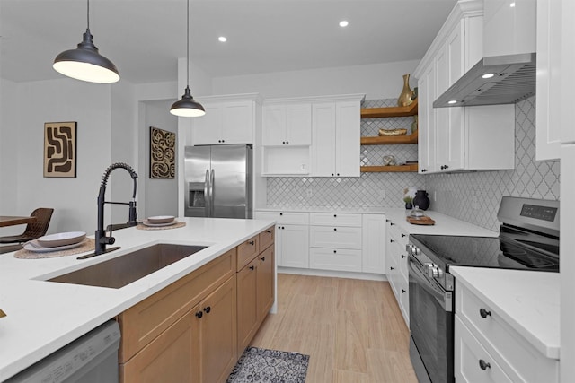 825 Rd 5501, Cleveland, TX 77327 - kitchen with appliances with stainless steel finishes, wall chimney exhaust hood, open shelves, light countertops, and recessed lighting
