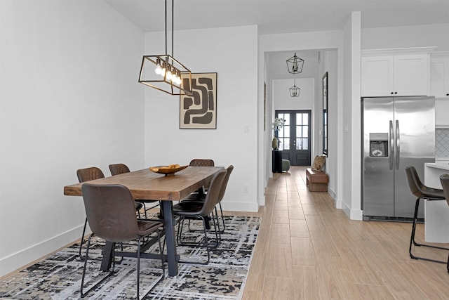 825 Rd 5501, Cleveland, TX 77327 - dining room with a chandelier and light wood-type flooring