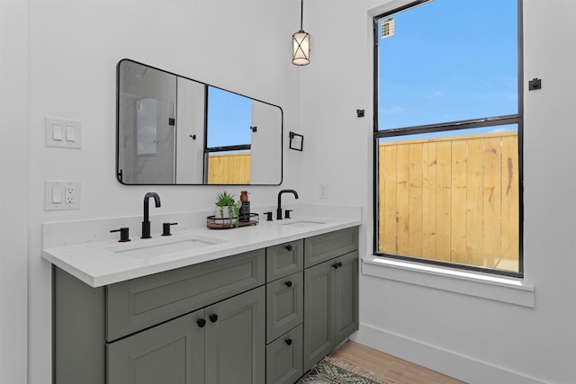 825 Rd 5501, Cleveland, TX 77327 - full bathroom featuring double vanity, healthy amount of natural light, and wood finished floors