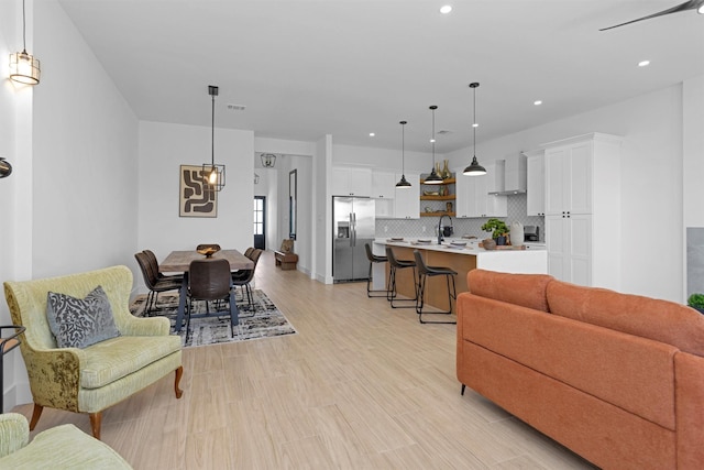 825 Rd 5501, Cleveland, TX 77327 - living room featuring recessed lighting and light wood-type flooring